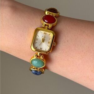 Vintage gold tone Kenneth Jay Lane watch with multicolored scarab stone band